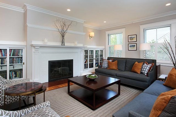 25 Woodside Road Newton, MA 02460 - Photo 2 of 13 a living room with furniture a rug and a fireplace