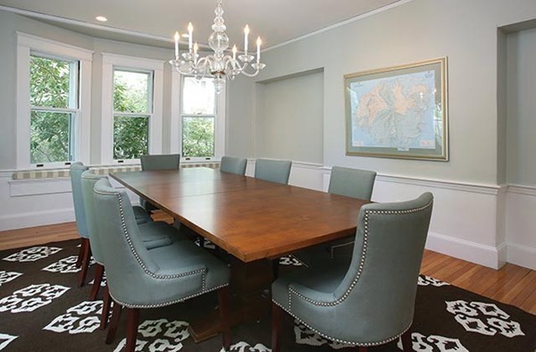 25 Woodside Road Newton, MA 02460 - Photo 3 of 13 a dining room with furniture a rug and wooden floor