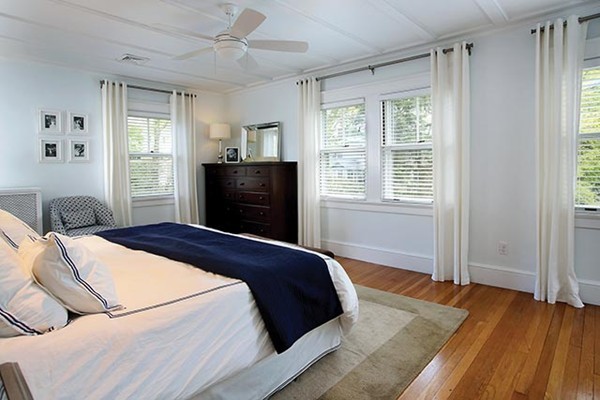 25 Woodside Road Newton, MA 02460 - Photo 8 of 13 a bedroom with a bed dresser and a window