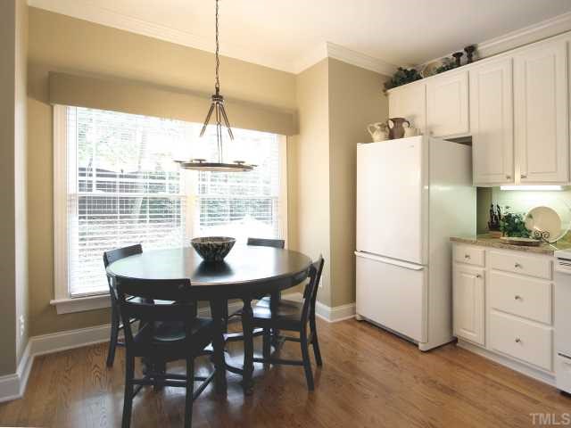 705 Scotts Ridge Trail Apex, NC 27502 - Photo 7 of 12 Enjoy that second cup of coffee in this delightful breakfast area overlooking the backyard. Hardwood floor. Double window. New light fixture.