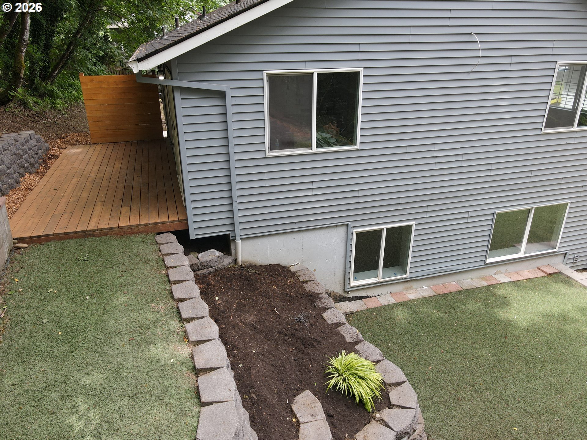 4024 Southeast 154th Place Portland, OR 97236 - Photo 34 of 43 a backyard of a house with table and chairs