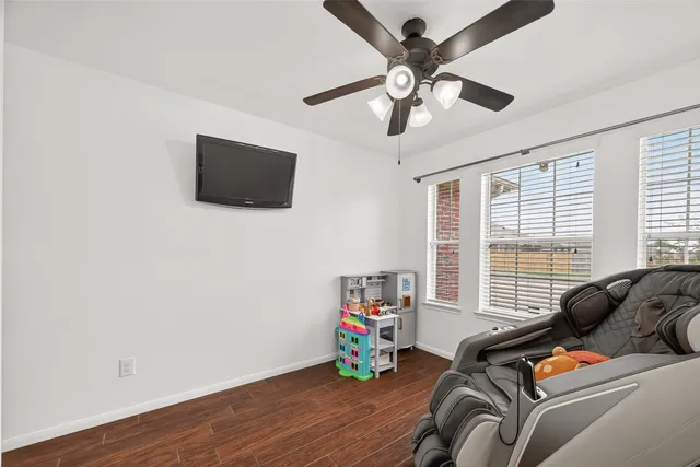 a bedroom with furniture and a window