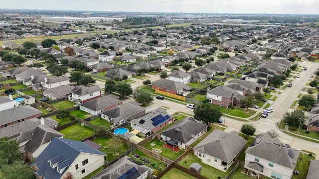 an aerial view of a city with lots of residential buildings
