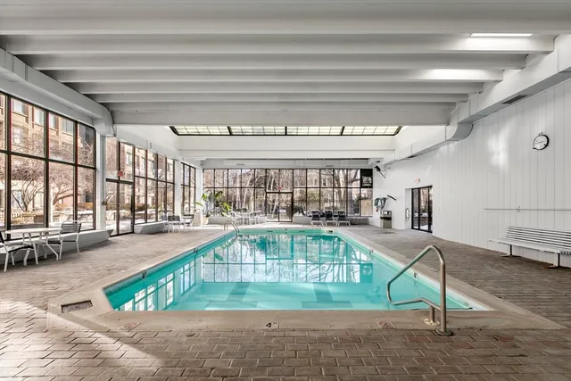 a view of a swimming pool with a lounge chairs