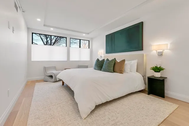 a bedroom with a bed and window