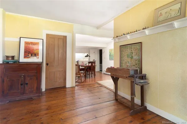 a view of a livingroom with furniture and wooden floor