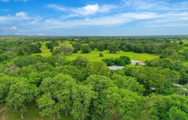 a view of a big yard with lots of green space and mountain view