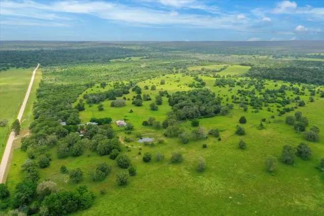 a view of a field with an ocean