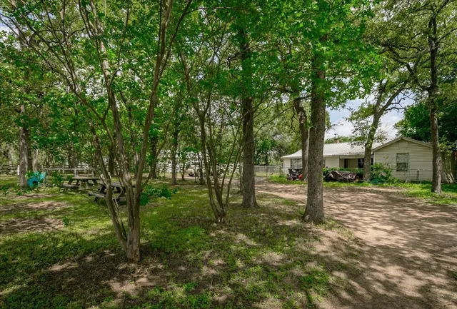 a backyard of a house with lots of green space