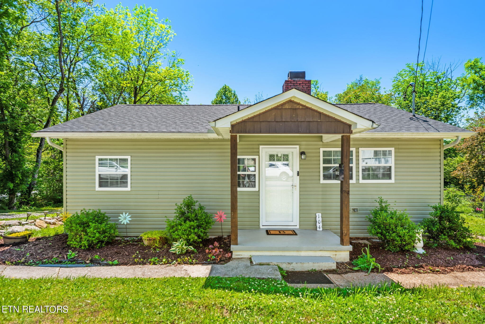104 Tucker Road Oak Ridge, TN 37830 - Photo 1 of 28 a front view of a house with a yard