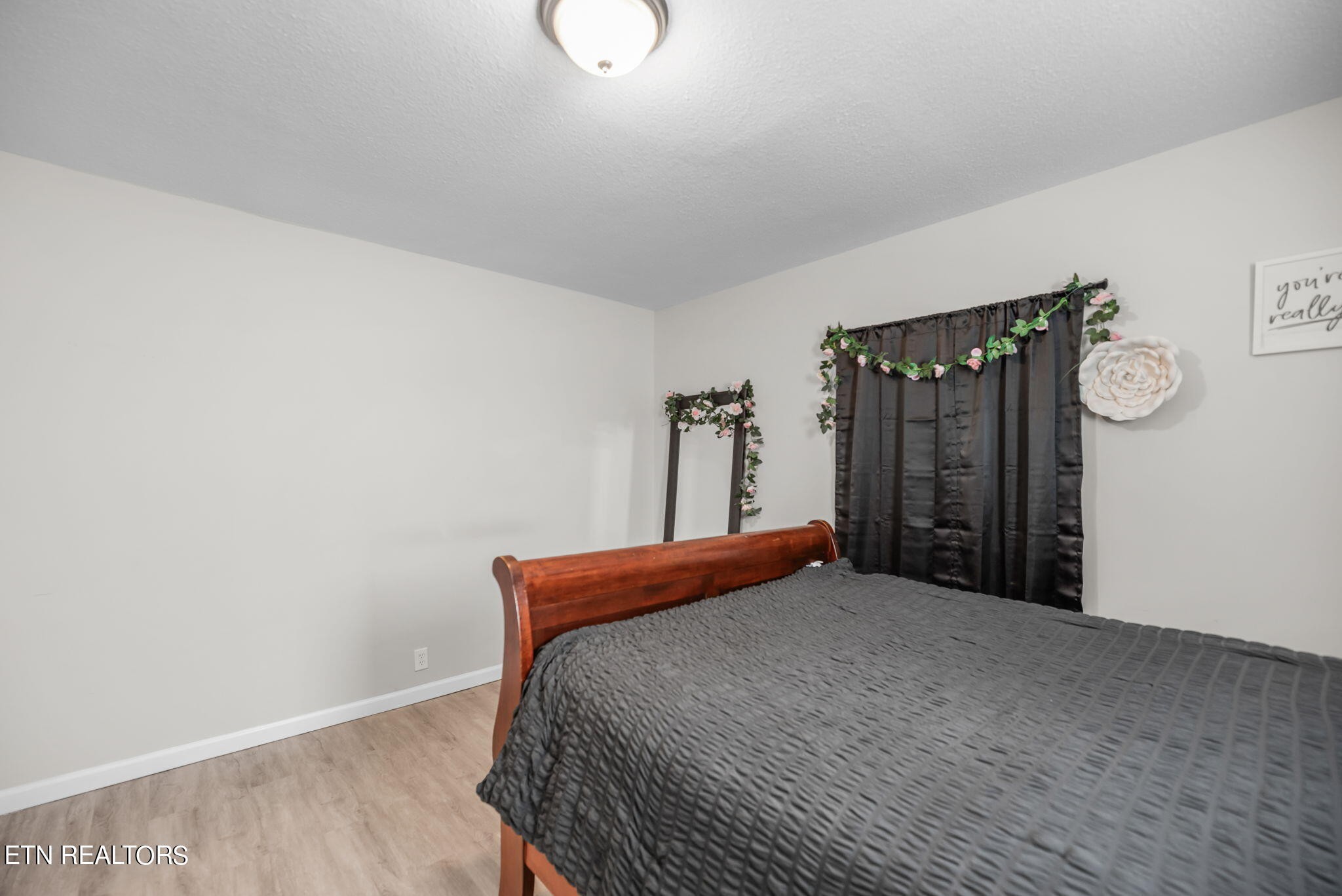 104 Tucker Road Oak Ridge, TN 37830 - Photo 11 of 28 a bedroom with a bed and a table
