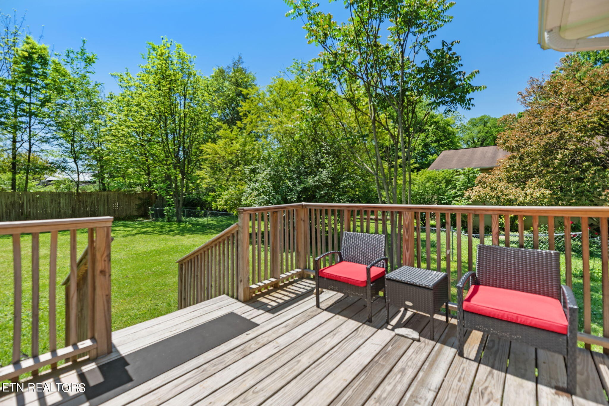 104 Tucker Road Oak Ridge, TN 37830 - Photo 23 of 28 a view of a deck with chairs a barbeque grill with wooden floor and fence
