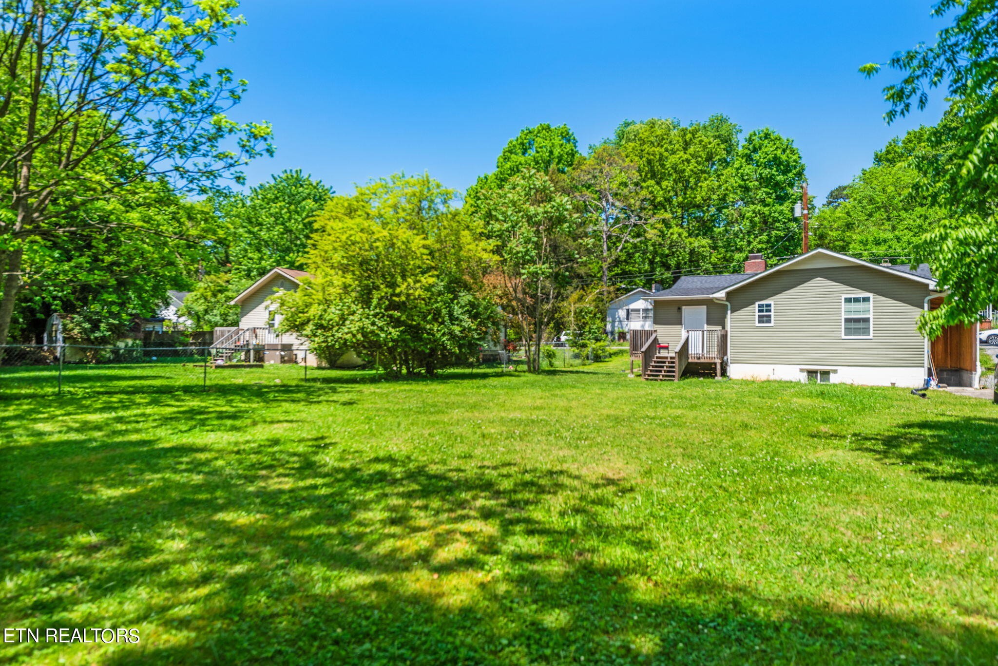 104 Tucker Road Oak Ridge, TN 37830 - Photo 27 of 28 a front view of a house with garden