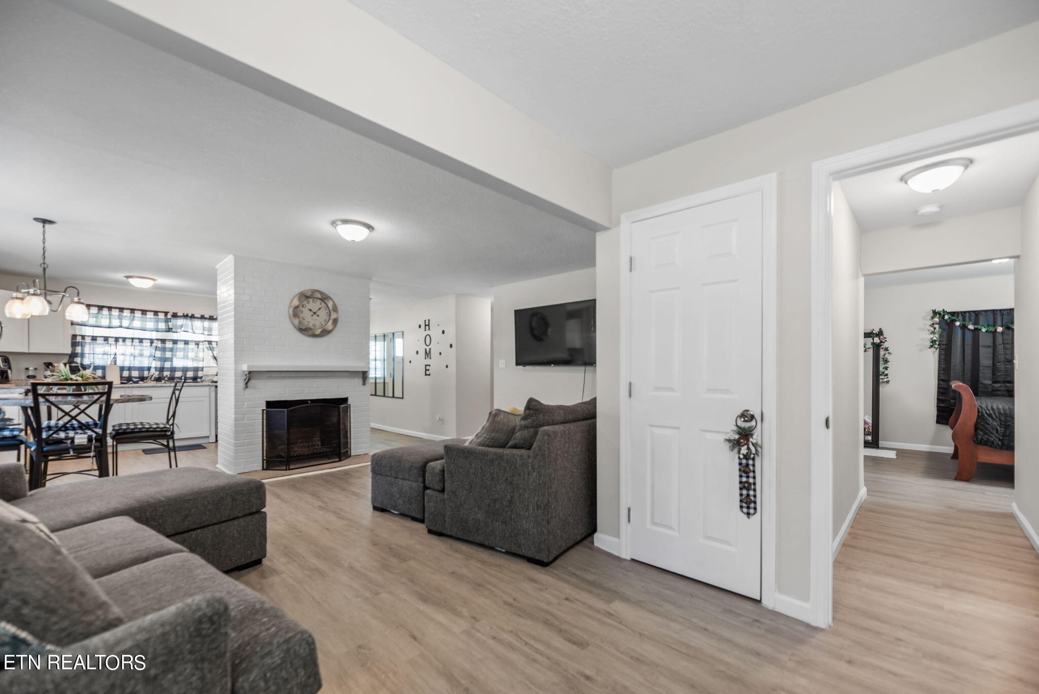104 Tucker Road Oak Ridge, TN 37830 - Photo 7 of 28 a living room with furniture and a fireplace