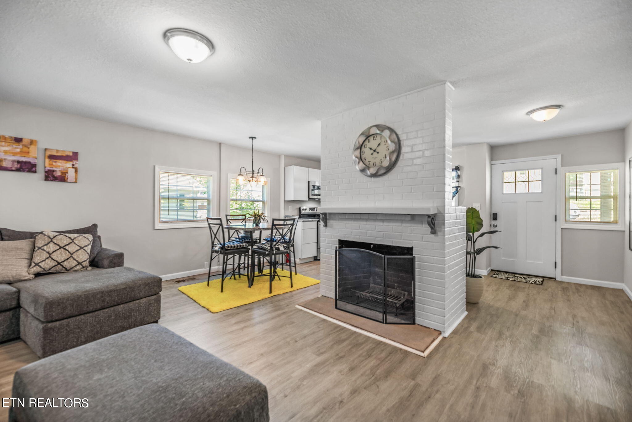 104 Tucker Road Oak Ridge, TN 37830 - Photo 8 of 28 a living room with furniture and a fireplace
