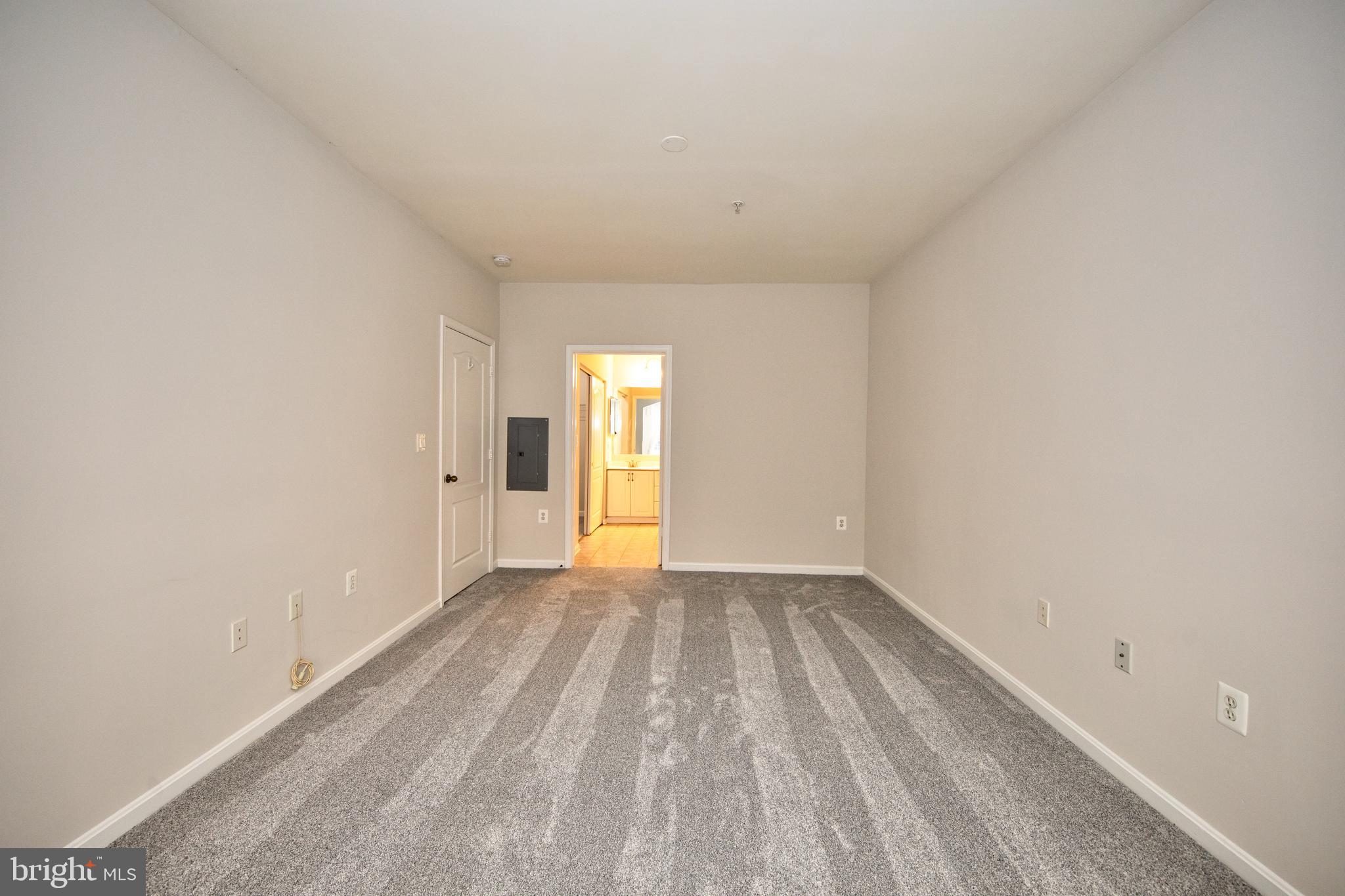 400 Symphony Circle, Unit 74B Cockeysville, MD 21030 - Photo 16 of 36 a view of an empty room and window