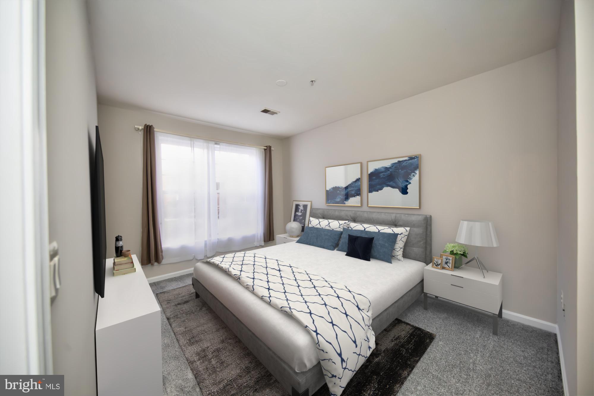 400 Symphony Circle, Unit 74B Cockeysville, MD 21030 - Photo 18 of 36 a bedroom with a bed and a table