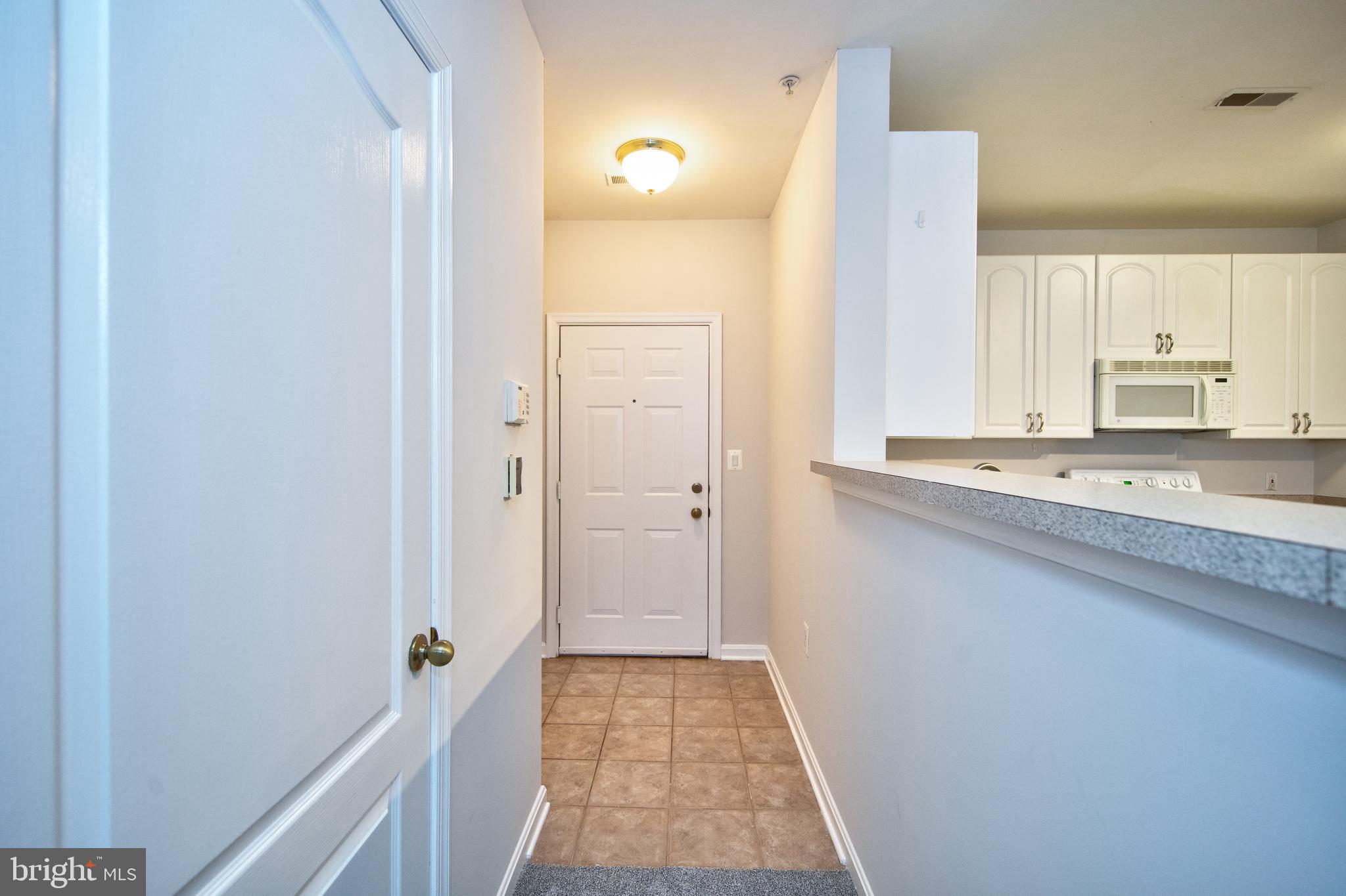 400 Symphony Circle, Unit 74B Cockeysville, MD 21030 - Photo 2 of 36 a bathroom with a sink and a mirror