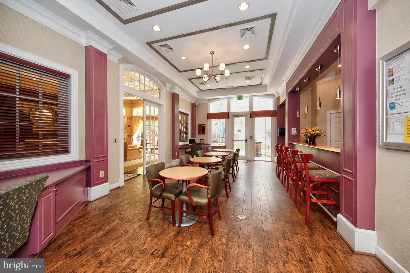 400 Symphony Circle, Unit 74B Cockeysville, MD 21030 - Photo 26 of 36 a view of a dining room with furniture window and wooden floor