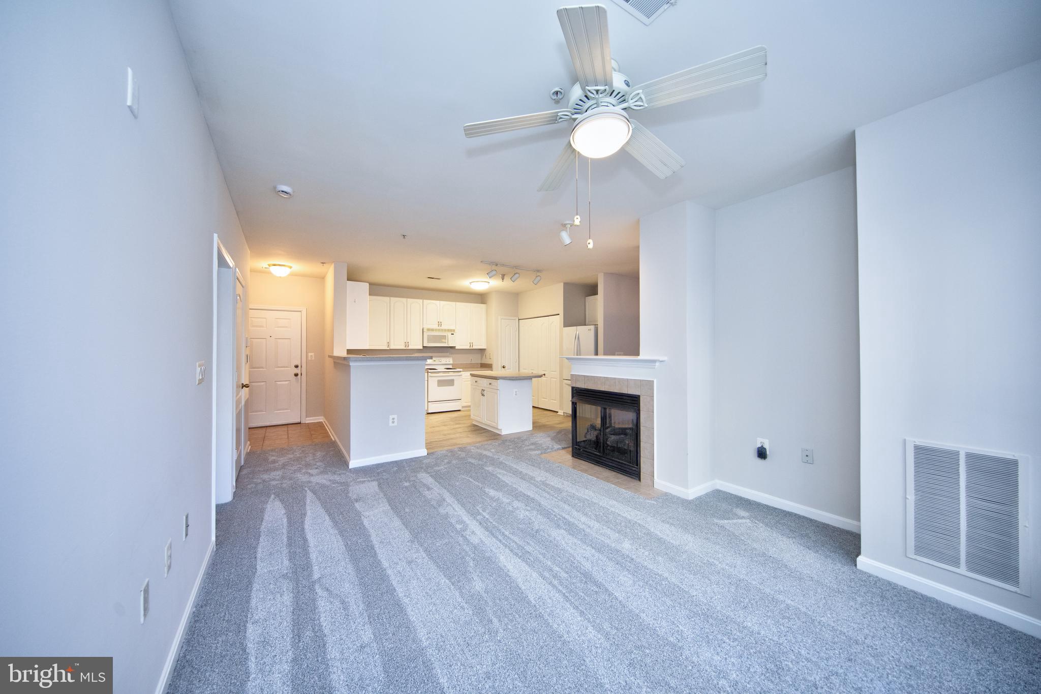 400 Symphony Circle, Unit 74B Cockeysville, MD 21030 - Photo 4 of 36 a view of a kitchen with a sink cabinets and wooden floor