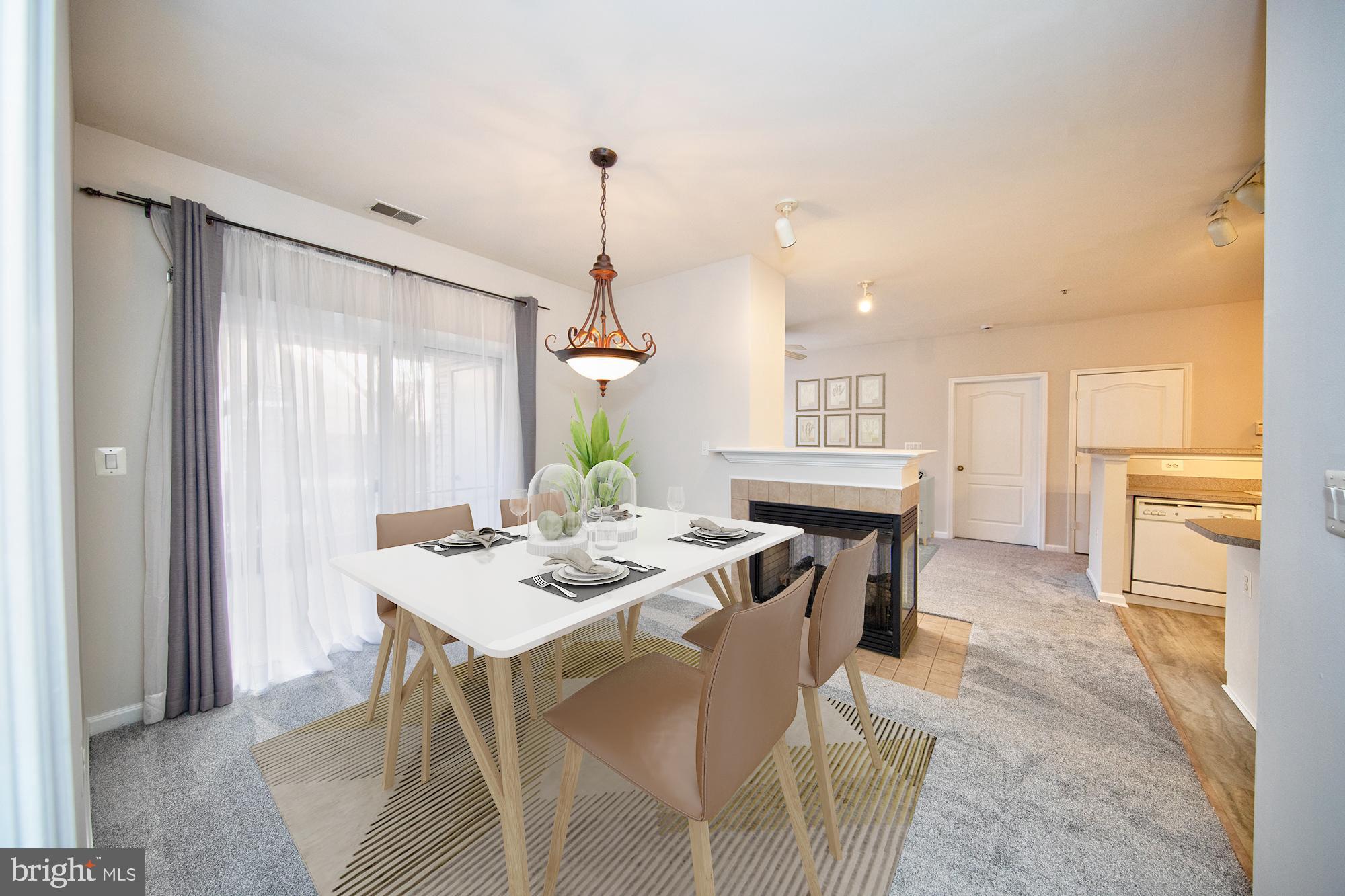 400 Symphony Circle, Unit 74B Cockeysville, MD 21030 - Photo 5 of 36 a view of a dining room with furniture
