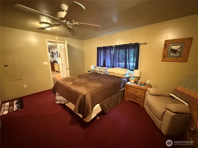 a view of a hallway with seating area