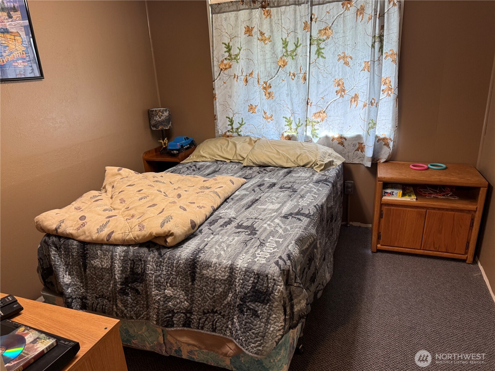 111 Tamarack Lane Dayton, WA 99328 - Photo 22 of 38 a bed sitting in a bedroom next to a window
