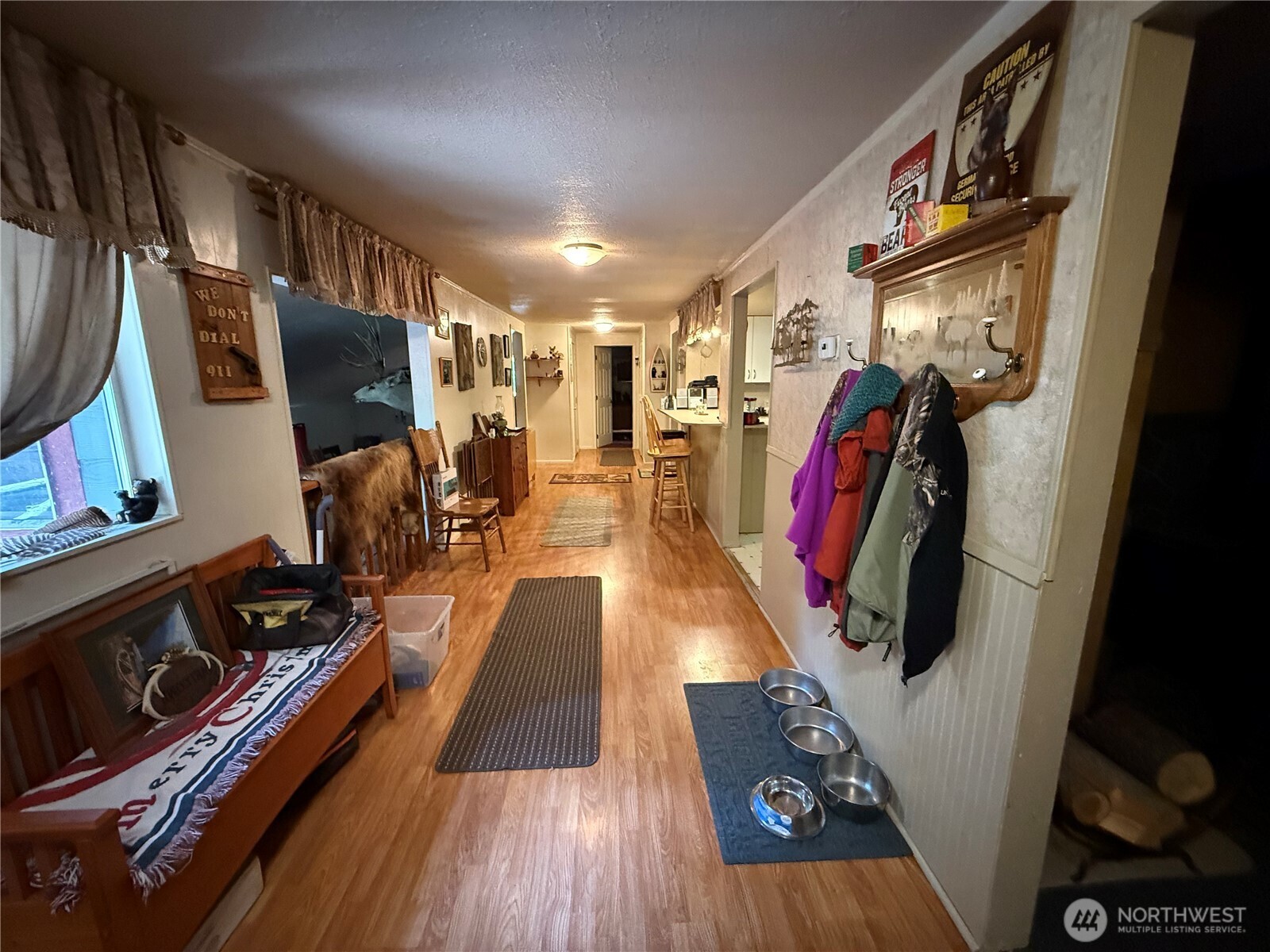 111 Tamarack Lane Dayton, WA 99328 - Photo 7 of 38 a view of a hallway with wooden floor and stairs