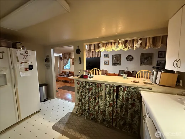 a bedroom with furniture and a mirror