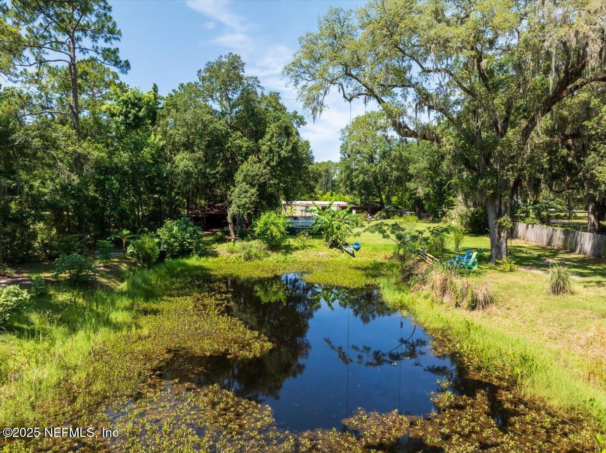 1489 Sheffield Road St. Johns, FL 32259 - Photo 3 of 9 a view of a lake with large trees