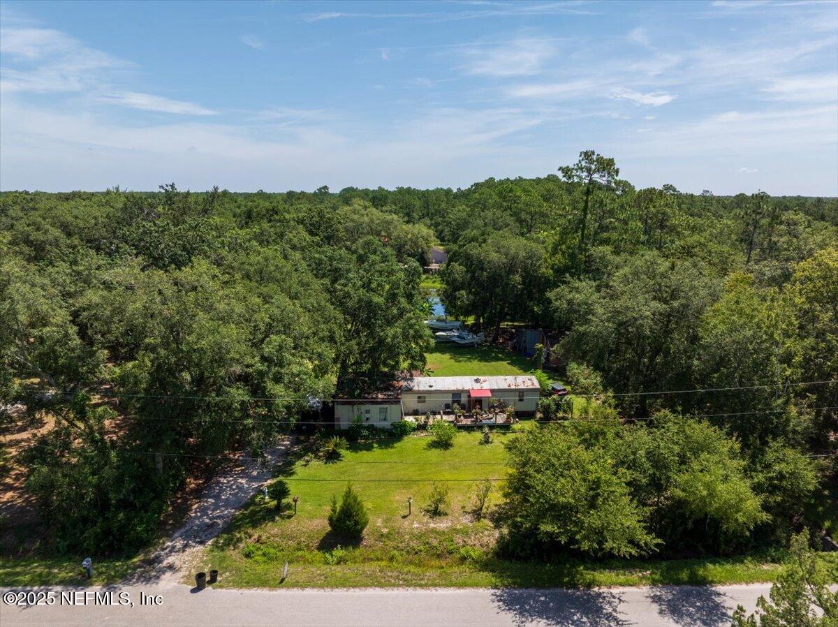 1489 Sheffield Road St. Johns, FL 32259 - Photo 8 of 9 a view of a big yard with swimming pool and green space