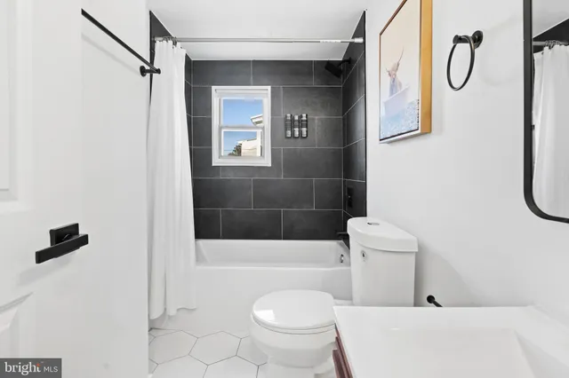 a bathroom with a shower a toilet and a shower