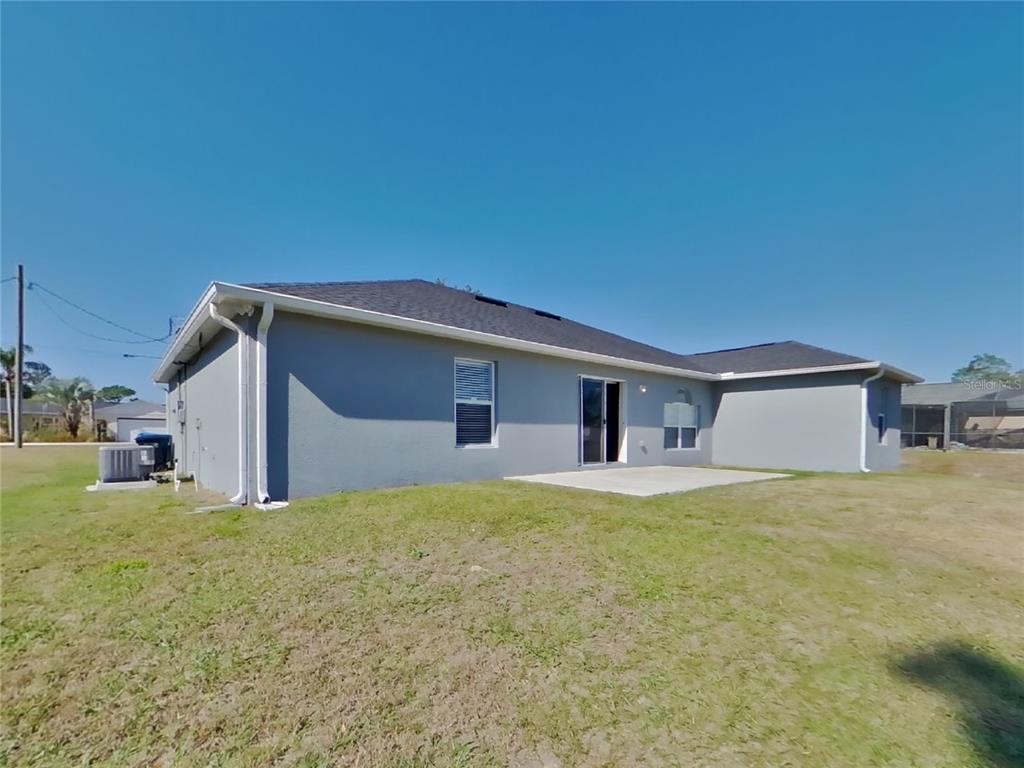 Undisclosed Address Spring Hill, FL 34608 - Photo 18 of 18 a house that has a big yard