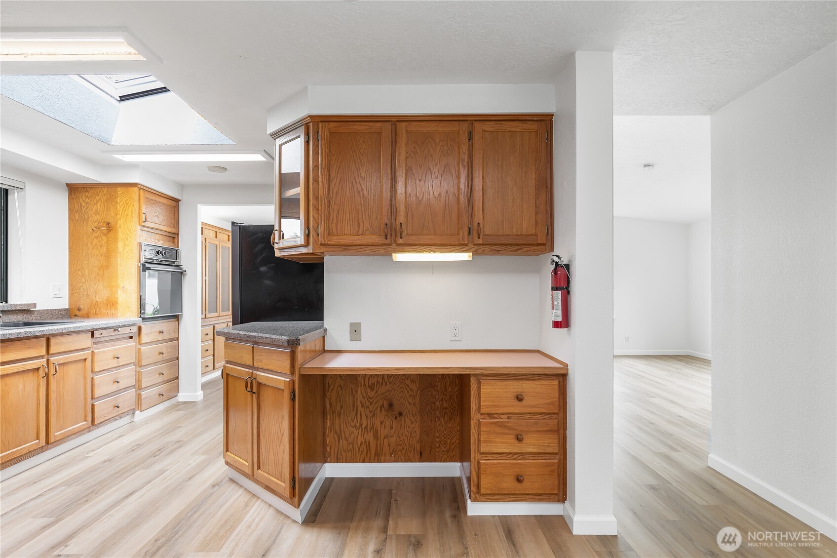 818 243rd Street Southwest Bothell, WA 98021 - Photo 14 of 40 a kitchen with a cabinets and wooden floor