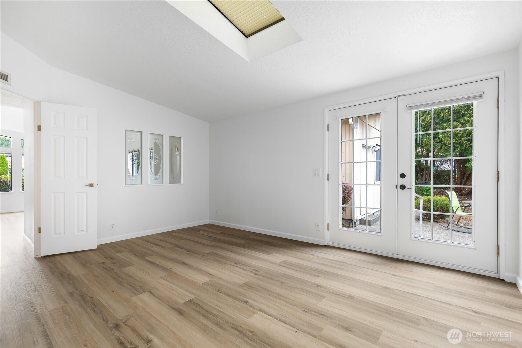 818 243rd Street Southwest Bothell, WA 98021 - Photo 16 of 40 an empty room with wooden floor and windows