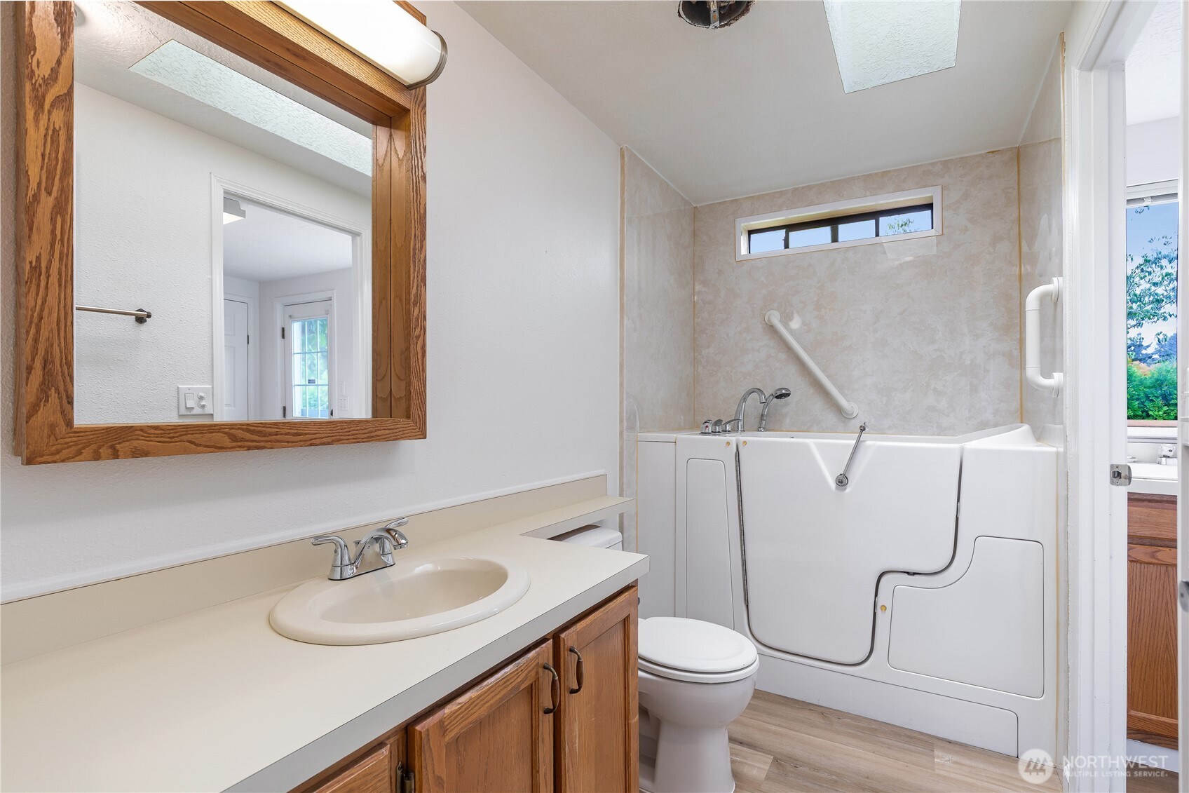 818 243rd Street Southwest Bothell, WA 98021 - Photo 19 of 40 a bathroom with a sink vanity mirror and toilet