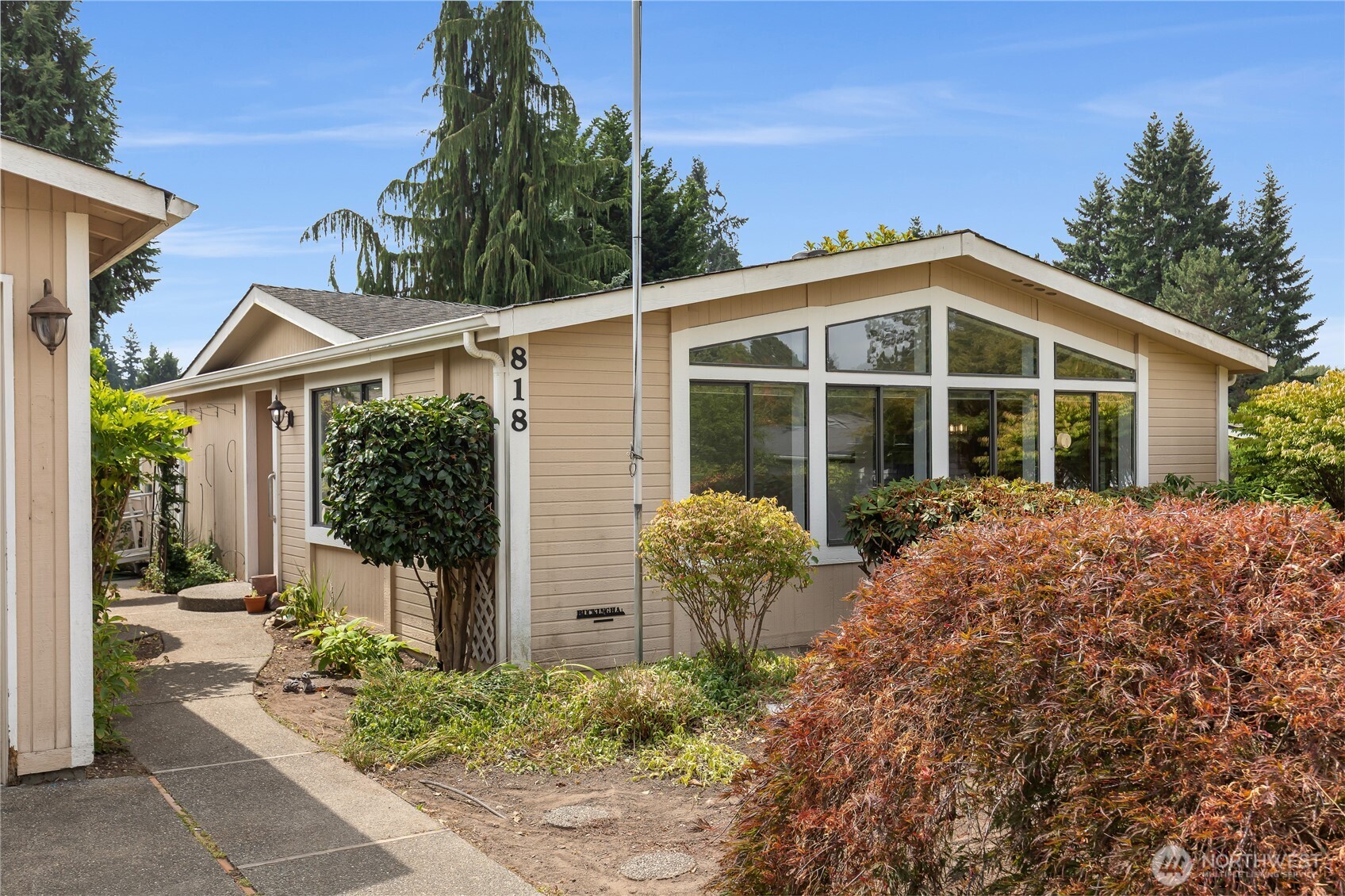 818 243rd Street Southwest Bothell, WA 98021 - Photo 2 of 40 a front view of a house with garden