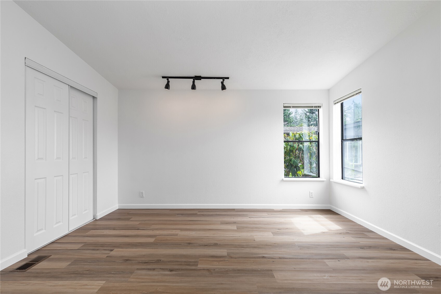818 243rd Street Southwest Bothell, WA 98021 - Photo 22 of 40 a view of a room with wooden floor and window