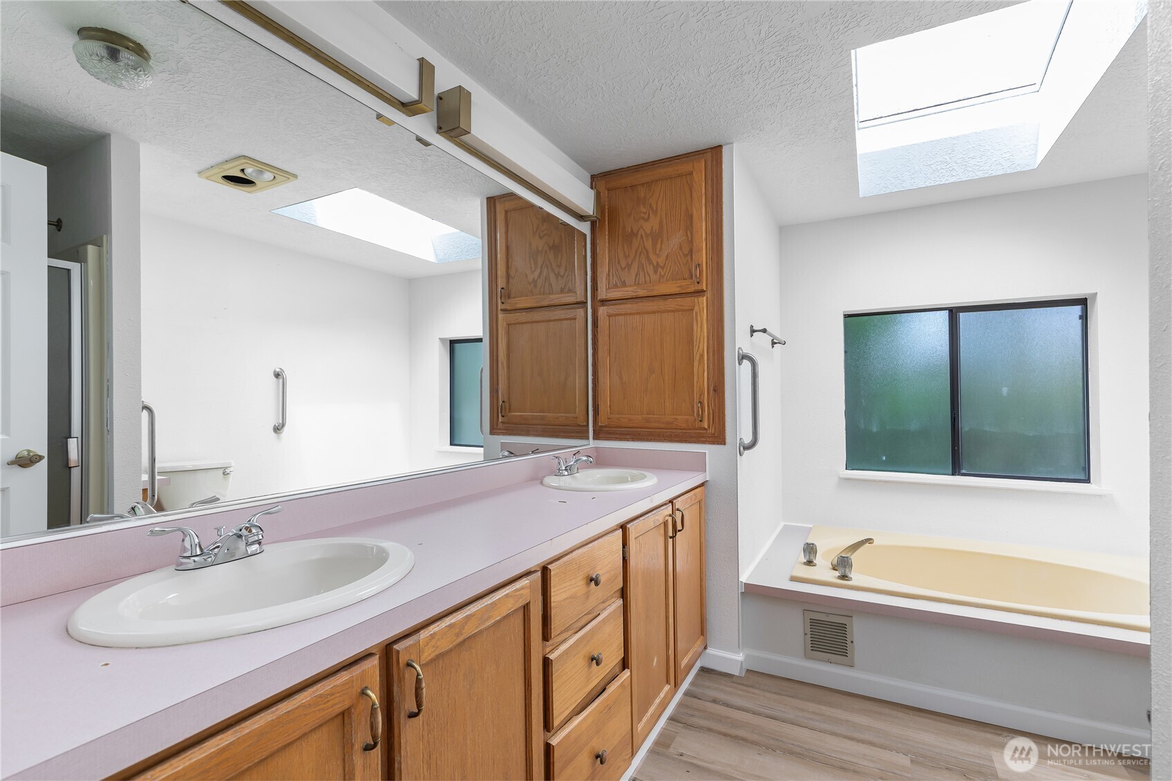 818 243rd Street Southwest Bothell, WA 98021 - Photo 24 of 40 a bathroom with a granite countertop sink and a mirror