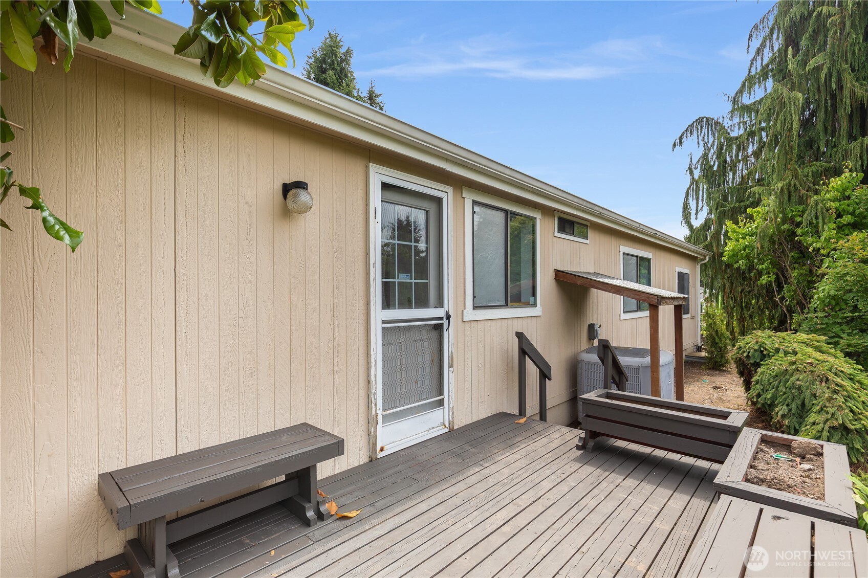 818 243rd Street Southwest Bothell, WA 98021 - Photo 32 of 40 a backyard of a house with wooden floor and outdoor seating