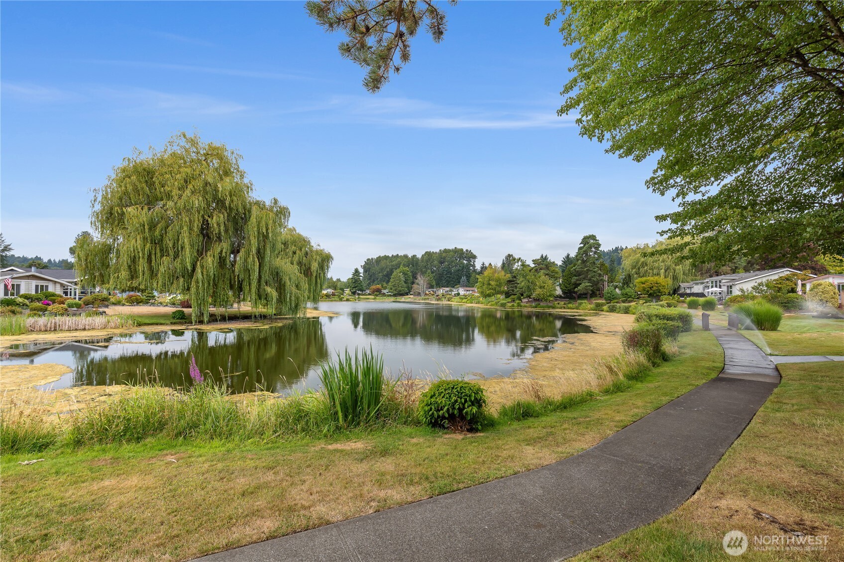 818 243rd Street Southwest Bothell, WA 98021 - Photo 34 of 40 a view of a lake with a house in the background