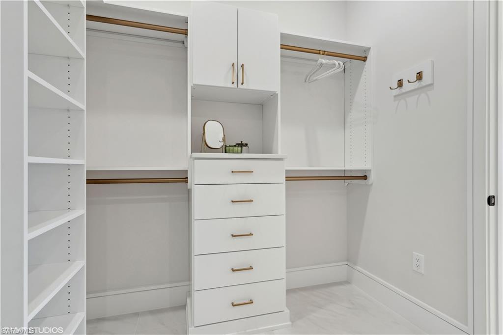 19791 Marino Lake Circle, Unit B5201 Miromar Lakes, FL 33913 - Photo 25 of 41 a view of white cabinets