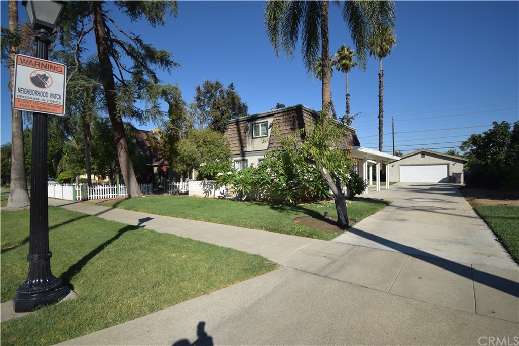4319 Merrill Avenue Riverside, CA 92506 - Photo 1 of 1 a view of a street with a building and a street sign