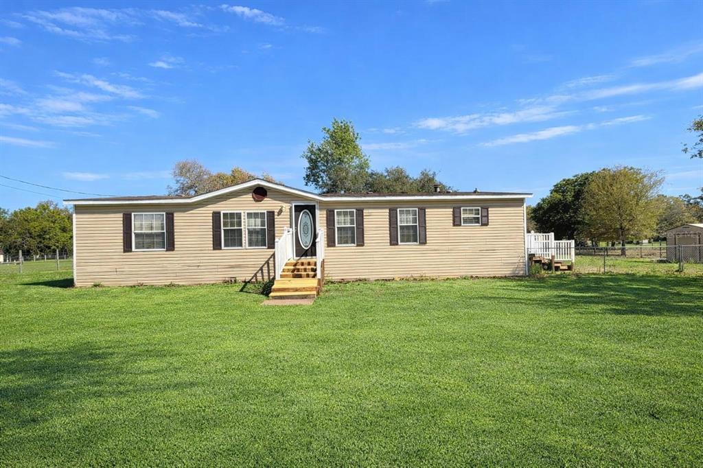 13201 Crowell Road Brooksville, FL 34613 - Photo 1 of 35 a view of a house with a backyard