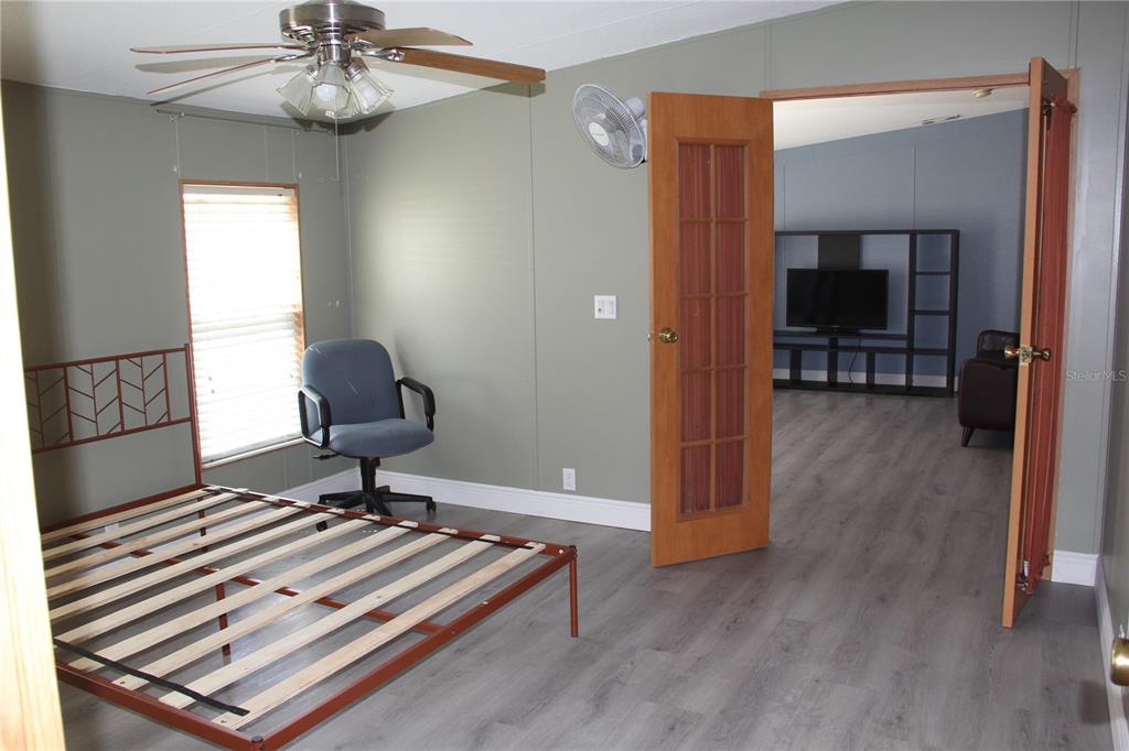 13201 Crowell Road Brooksville, FL 34613 - Photo 14 of 35 a view of a workspace with furniture and a window