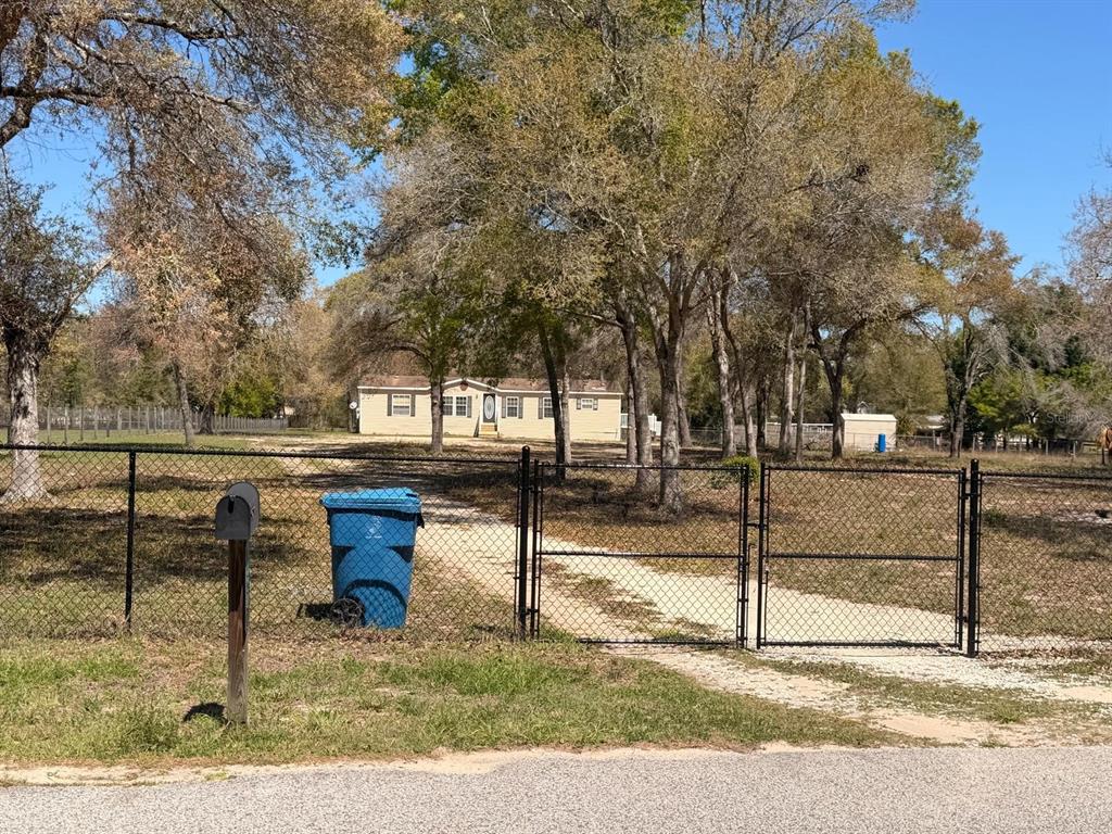 13201 Crowell Road Brooksville, FL 34613 - Photo 25 of 35 a view of a yard with sitting area