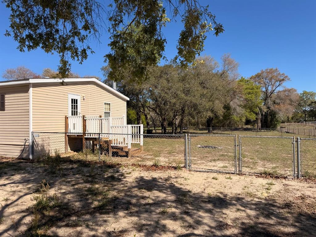 13201 Crowell Road Brooksville, FL 34613 - Photo 27 of 35 a view of a house with a yard