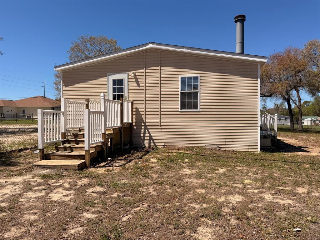 13201 Crowell Road Brooksville, FL 34613 - Photo 28 of 35 a view of a house with a yard