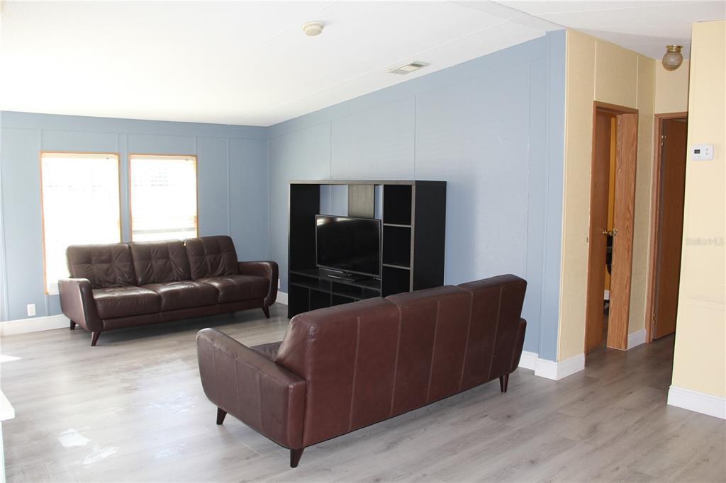 13201 Crowell Road Brooksville, FL 34613 - Photo 3 of 35 a living room with furniture and a window