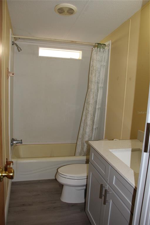 13201 Crowell Road Brooksville, FL 34613 - Photo 34 of 35 a bathroom with a sink a toilet and shower